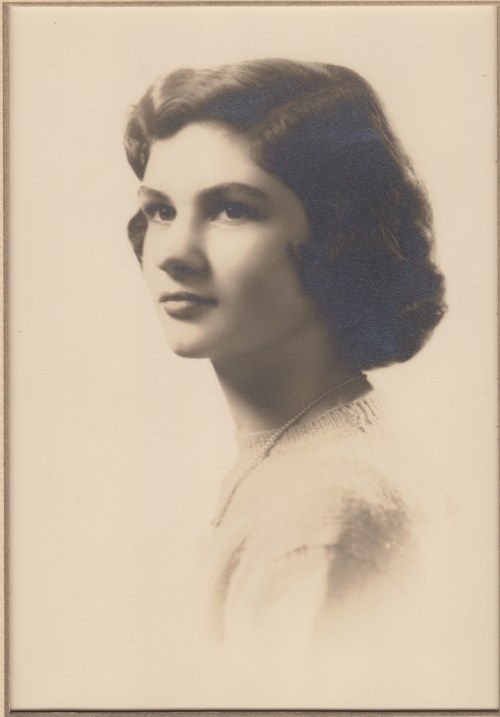 This is not "the" picture--I don't have a copy--but here she is graduating from high school.