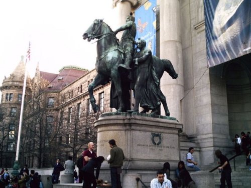 Theodore Roosevelt and Indian mate guard the front door.