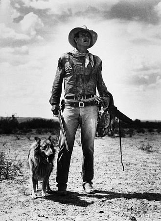 John Wayne in the iconic Hondo pose with Dog