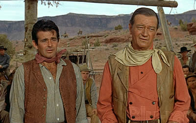 Stuart Whitman (who replaced James Garner, Charlton Heston and several others) and the Duke in that iconic faded red shirt, leather vest and kirchief.