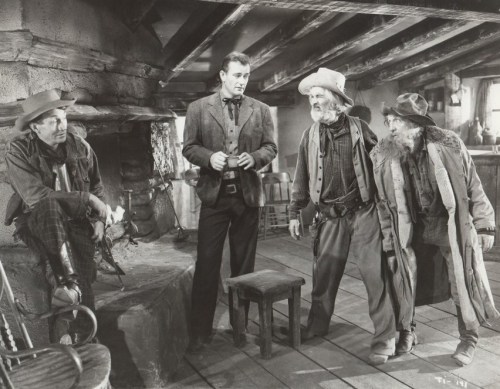 John Wayne and some old coots in "Tall in the Saddle"